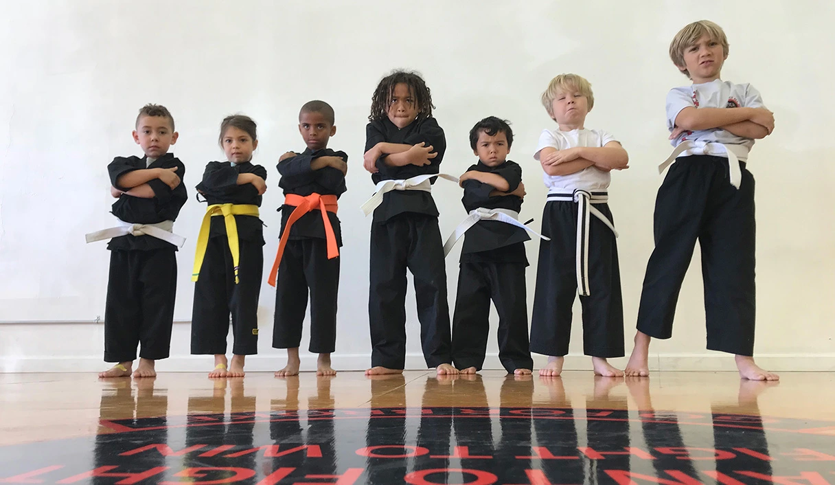 Young students lined up in uniform at James Martial Arts Academy in El Cajon